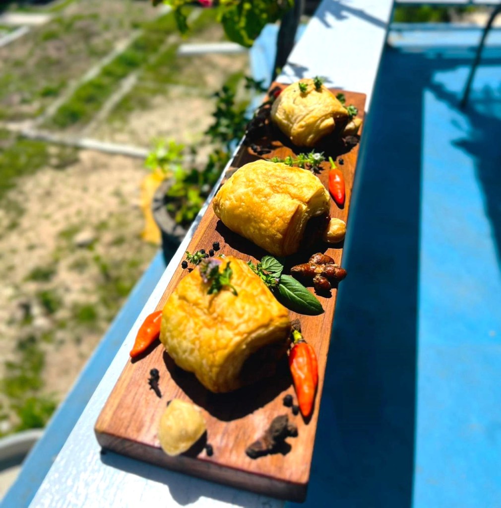 Plate with sausage rolls.