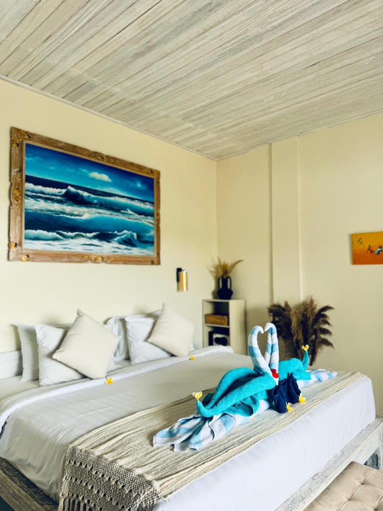 Side view of bed in ocean room one