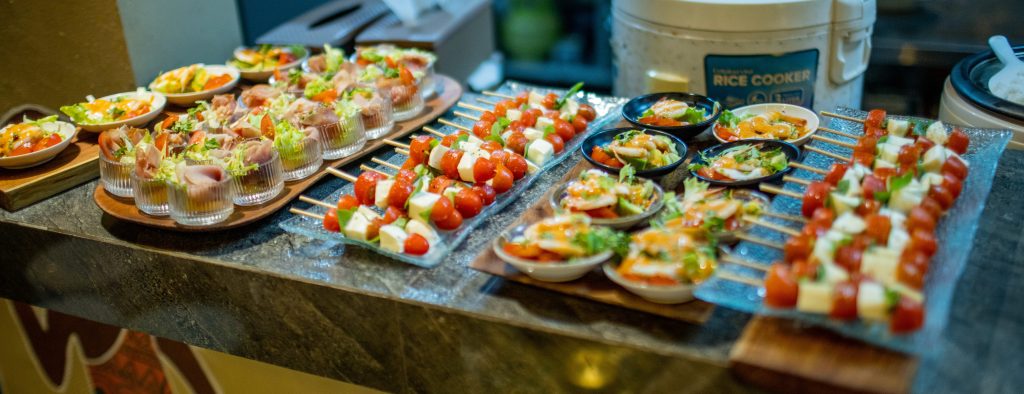 Multiple large plates full of various platters.