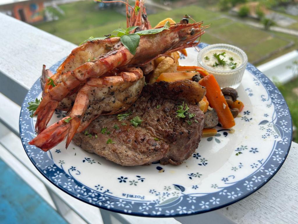 Plate with steak and prawns